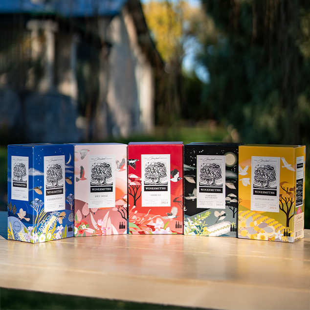 the winesmiths x clair ishino range on a background featuring art from the exclusive collaboration packs